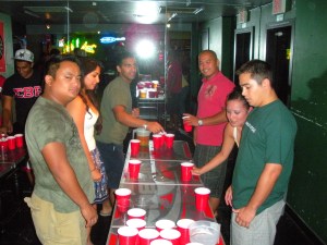 The flip cup obstacle course include the standing spins, laps around the table and a slalom run.