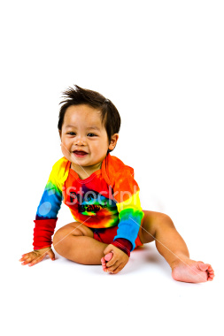 ist2_4448466-cute-baby-boy-in-rainbow-outfit-sitting